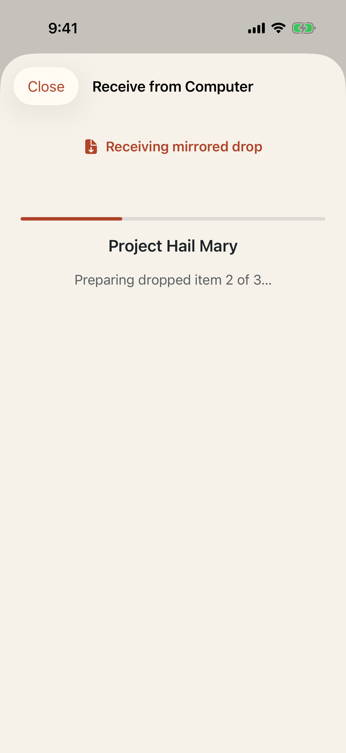 Bookshelf receiving an audiobook dropped through iPhone Mirroring